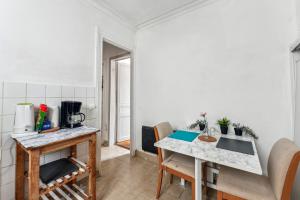 a kitchen with a table and a counter top at Wonderful apartment close Champs-Elysées in Paris