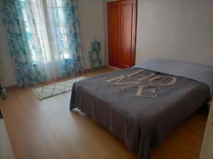 a bedroom with a bed with the number on it at Belle maison a Brizay in Brizay