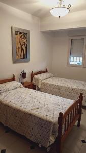 Un pat sau paturi într-o cameră la Kame House