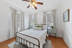 a bedroom with a bed and a ceiling fan at Large Groups Welcome - 2 Homes Next Door in New Iberia