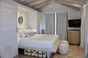 Postel nebo postele na pokoji v ubytování Naay Boutique Hotel Holbox