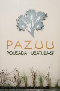 una señal para un complejo pomodoro ubatalegas en Pousada Pazuu en Ubatuba