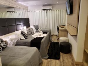 Voodi või voodid majutusasutuse Lages Plaza Hotel toas
