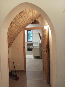 an archway leading into a kitchen with a sink at Appartement Fassbinder in Hall in Tirol