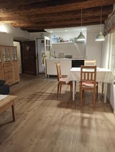 a kitchen and dining room with a table and chairs at Appartement Fassbinder in Hall in Tirol