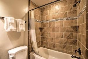 a bathroom with a tub and a toilet and a sink at Angel Rock Rentals of Moab Unit 2 in Moab