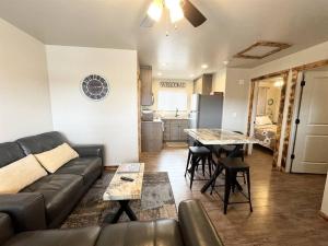 a living room with a couch and a table and a kitchen at Angel Rock Rentals of Moab Unit 2 in Moab