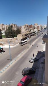 a city street with cars parked on the side of the road at Luxry flat in matrouh in Marsa Matruh