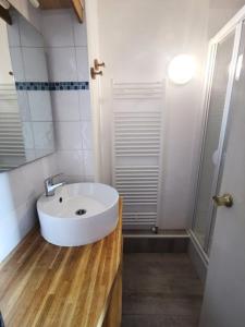 a bathroom with a white sink and a shower at Résidence Sikkim - Studio pour 2 Personnes 764 in Aime-La Plagne