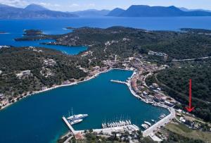 an aerial view of a harbor with a boat in the water at Mistral Boutique Hotel in Meganisi