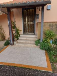 a front door of a house with a gate at Affittacamere da Elio e Renata in Calvi dellʼ Umbria