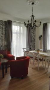 a living room with a table and a dining room at Ferienwohnung Silva in Dresden