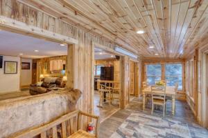 a log home living room and dining room at Hygge House on the Creek in Rapid City