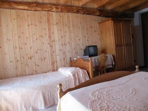 Postel nebo postele na pokoji v ubytování Hotel Tamola