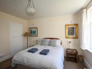 מיטה או מיטות בחדר ב-Bryn Meillion