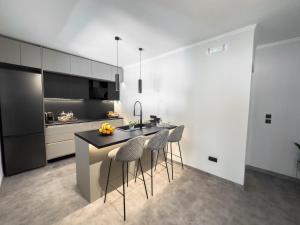 Kuchyň nebo kuchyňský kout v ubytování Ixia home