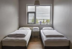 Letto o letti in una camera di Hótel Laugarvatn