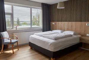 Letto o letti in una camera di Hótel Laugarvatn