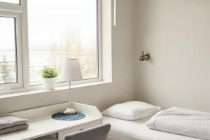 Letto o letti in una camera di Hótel Laugarvatn