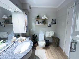 a bathroom with a sink and a toilet at Ixia home in Ixia