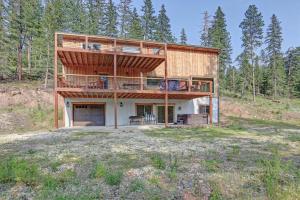 a house on a hill with a balcony at Wildercreek Cabin in Lead