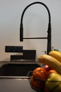 Kuchyň nebo kuchyňský kout v ubytování Ixia home