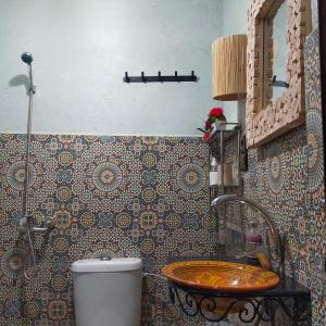 a bathroom with a sink and a toilet at Atlas Haven in Imlil