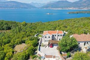 an image of a house with a view of a lake at Villa Vista Azzurra in Tivat