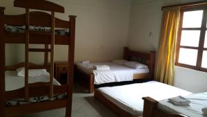 Postel nebo postele na pokoji v ubytování Hotel Tamarindo Resort + 3 fotografie