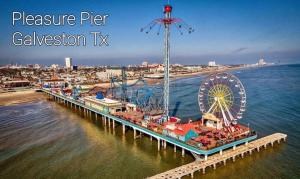 a pier with a amusement park and a ferris wheel at Tourist Hotspot Walk to Beach Hangout & Relax in Galveston +43 photos
