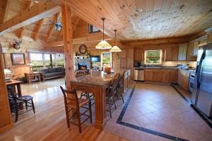 a large kitchen with a large island in a house at Brew with a View Lodge in Ducktown