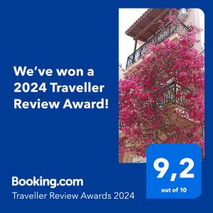 Una señal que dice que ganamos un premio de revisión de viajero en Bougainvillea apartment, en Zakynthos