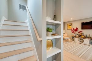 a staircase in a house with a living room at Luxury Condo, Steps to Downtown Montclair and Train! in Montclair
