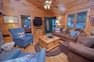 a living room with a couch and a tv at Laurel Creek- Blue Ridge in Blue Ridge