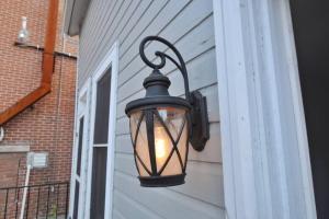 a lantern hanging on the side of a building at Housepitality - The Marienplatz - Free Parking in Columbus