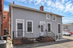 a gray house with a brick at Housepitality - The Marienplatz - Free Parking in Columbus +35 photos