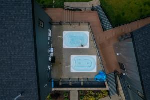 an overhead view of a backyard with a swimming pool at Basecamp Resorts Revelstoke in Revelstoke
