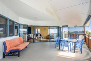 a living room with a table and chairs at Windsurfer Beach House in Lancelin