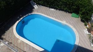 an overhead view of a blue swimming pool at Villa Felicia in Villapiana