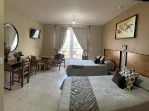 Postel nebo postele na pokoji v ubytování Hotel el Leñador