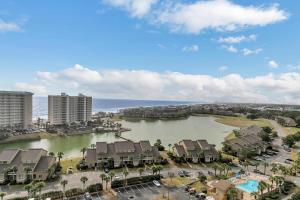 an aerial view of a lake with houses and condos at Ariel Dunes II 1301 in Destin