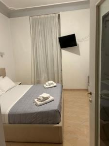 מיטה או מיטות בחדר ב-Manarola apartament