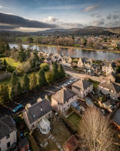 an aerial view of a town with a river at Ness at the Park in Inverness