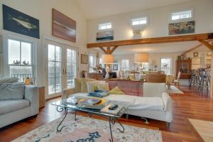 a living room with a couch and a table at Beautiful Aquinnah Home Ocean View, Walk to Beach in Lobsterville