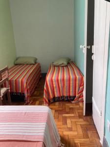 A bed or beds in a room at Pousada Barão de Santa Helena