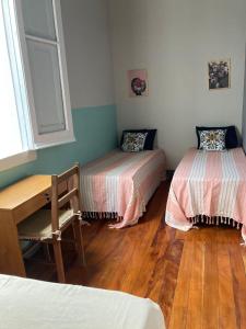 Un pat sau paturi într-o cameră la Pousada Barão de Santa Helena
