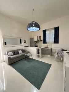 a living room with a couch and a table at Residenza Santi ai Monti in Rome