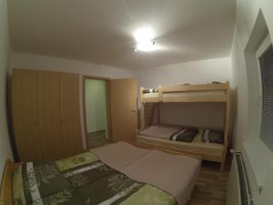 a small room with two bunk beds in it at Apartments Demec in Kranjska Gora