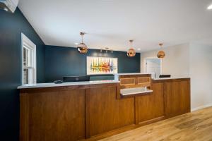 a kitchen with blue walls and a counter at Best Western - Freeport Inn in Freeport