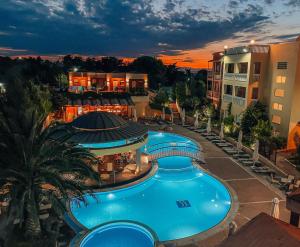 an overhead view of a swimming pool at a resort at Ambassador Hotel Thessaloniki in Plagiárion